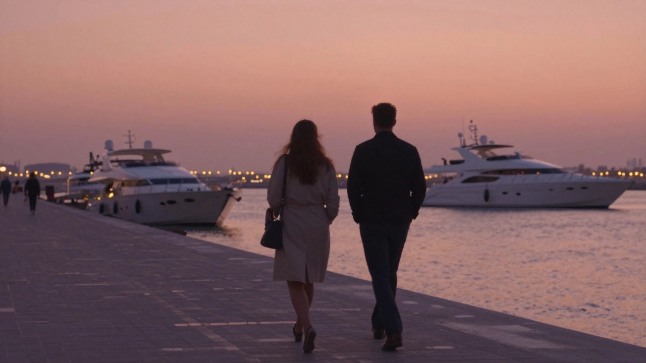 Two figures walking side by side along Dubai Marina at dusk, silhouetted against the sunset.